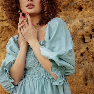 Ruched body details and lush sleeves 