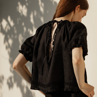 Back cut out details of black linen top