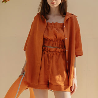 Orange linen shorts with elastic waist and pockets
