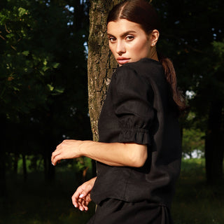 Side view black linen top with puffed sleeves